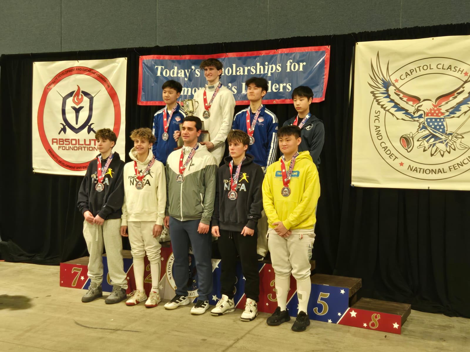 Cadet Men’s Épée medalists on the podium at the Capitol Clash SYC/RCC
