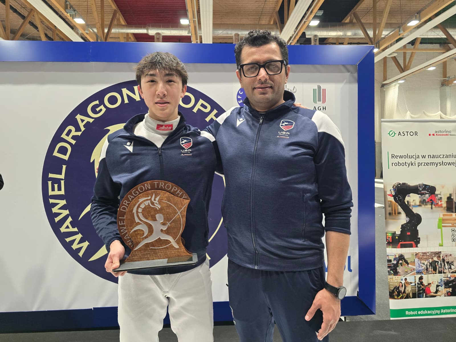 Alan Lam and his coach with the Wawel Dragon Trophy after the Cadet World Cup in Krakow
