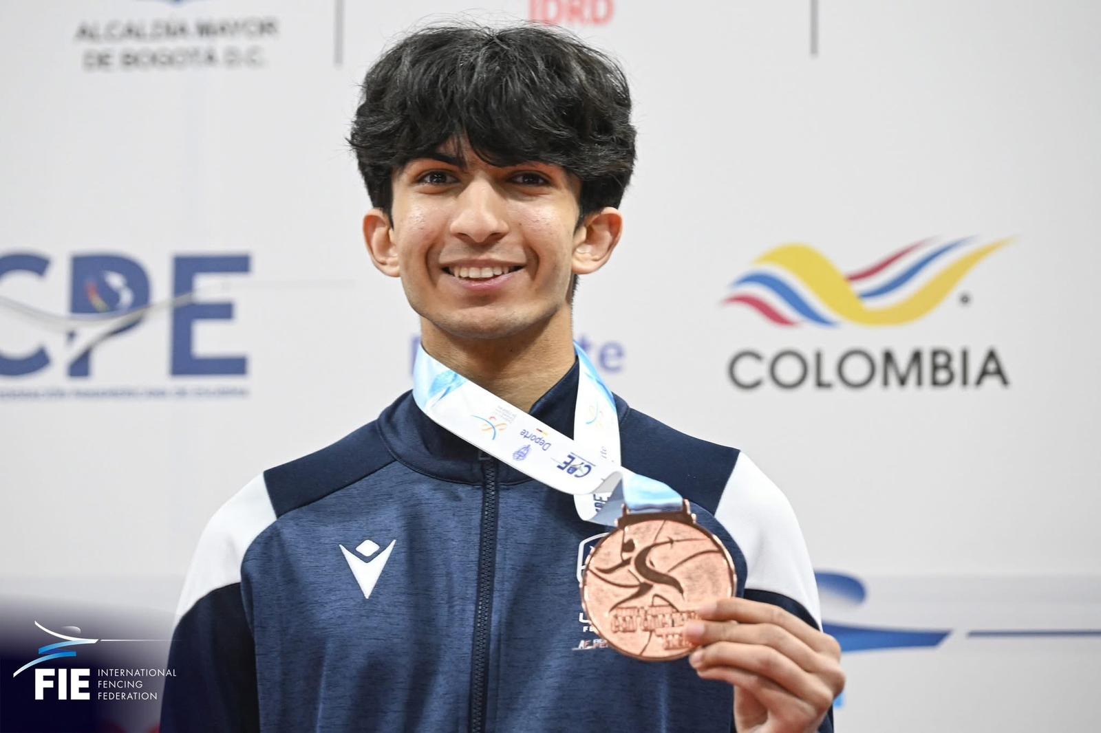 Ravin Singh wearing his bronze medal after the 2026 Pan American Fencing Championships